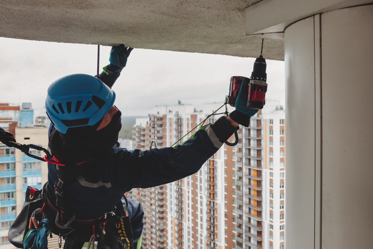 an-industrial-climber-performs-installation-work-on-a-building-in-a-megalopolis.jpg